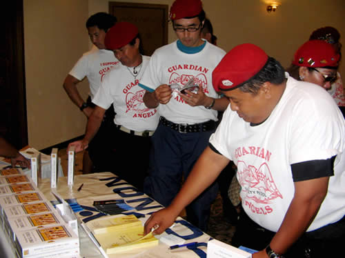 Here you can see Guardian Angels receiving copies of 'Keeping Your Kids Drug Free' kit